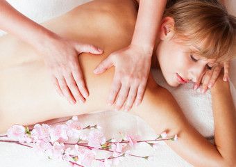 Obraz na płótnie Canvas Massage and body care. Spa body massage woman hands treatment. Woman having massage in the spa salon