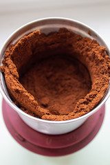 Ground coffee in a coffee grinder