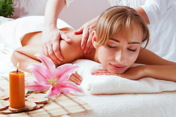 Massage and body care. Spa body massage woman hands treatment. Woman having massage in the spa salon