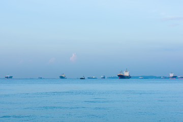 Cargo ships and oil tankers anchored offshore along the Singapore Straight, in Singapore