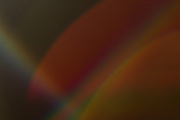 Lens flare and light leak haze texture on a black background.