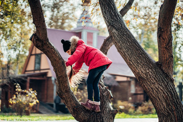 Little Girl to climb a tree