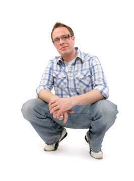A young adult male wearing glasses, isolated on white.