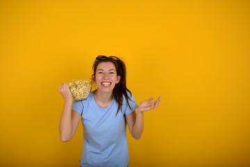joyful woman in cinema with popcorn