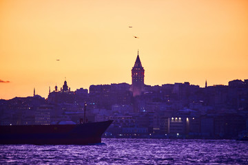 Fototapeta premium Istanbul cityscape in Turkey with Galata Kulesi Tower. Ancient Turkish famous landmark in Beyoglu district, European side of city. Architecture of the Constantinople.Historical place made by Genoese