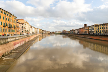 Sights of Arno River from Ponte di Mezzo Bridge in Pisa, Tuscany Region, Italy.