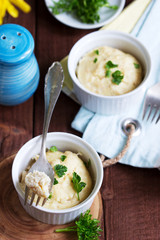 Dietary souffle of minced meat with parsley on a dark background.