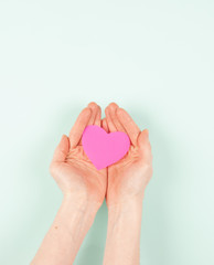 Obraz premium heart in the hands of outstretched, give love, protect love, cherish, love in the hands of