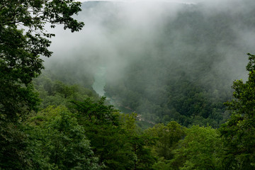 Fototapeta na wymiar The New River Gorge in Fayette, West Virginia is encased in fog.