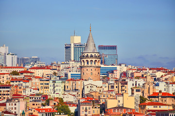 Fototapeta na wymiar Istanbul cityscape in Turkey with Galata Kulesi Tower. Ancient Turkish famous landmark in Beyoglu district, European side of city. Architecture of the Constantinople.Historical place made by Genoese