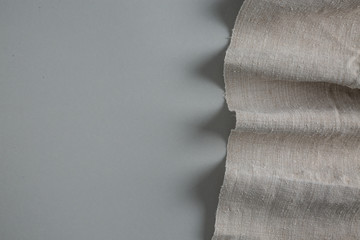 Linen wrinkled tablecloth fabric pattern background.
