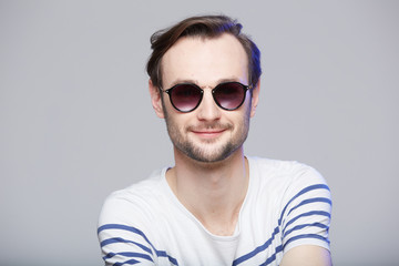 Fototapeta premium Studio shot of handsome man wearing sunglasses