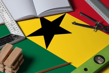 Ghana national flag on profession concept with architect desk and tools background. Top view mock-up.