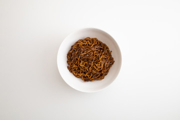 black bean sauce noodles in a White Bowl.
Korean name Jjapaguri.