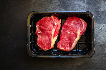 raw steak meat (beef or veal cooking) menu concept keto or paleo diet
background. top view. copy...
