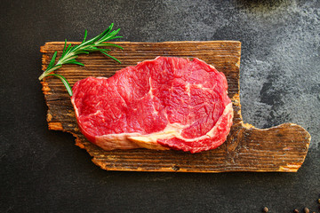 raw steak meat (beef or veal cooking) menu concept keto or paleo diet
background. top view. copy...
