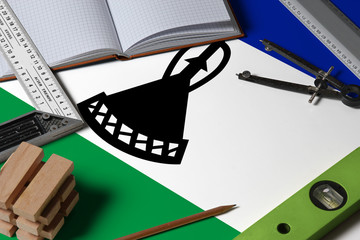 Lesotho national flag on profession concept with architect desk and tools background. Top view...