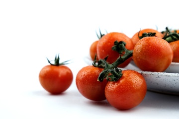 small cherry tomatoes on a white background