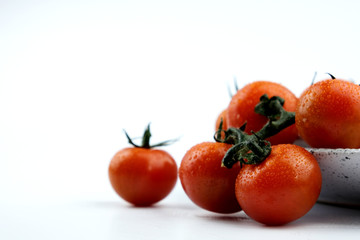 small cherry tomatoes on a white background