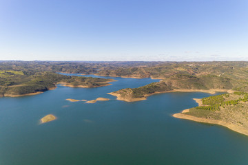 Aerial drone view of Barragem de Odeleite Dam reservoir in Alentejo, Portugal
