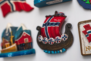 View of traditional tourist souvenirs and gifts from Lofoten Islands, Nordland, Norway, fridge magnets with text 