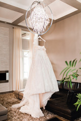 wedding dress on a hanger