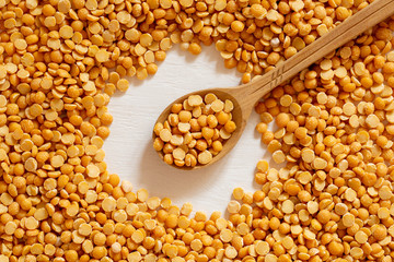 Yellow split peas background. Dry cereal for cooking.