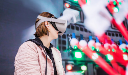 Girl in virtual reality glasses at the exhibition