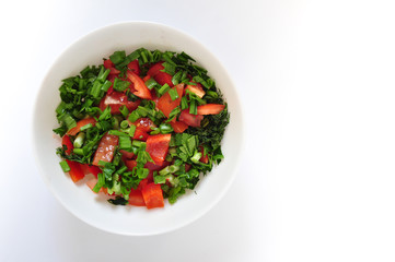 a plate of fresh vegan salad isolated white background