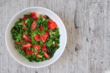 a plate of fresh vegan salad isolated white background