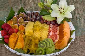 Healthy fresh fruits in a basket on table