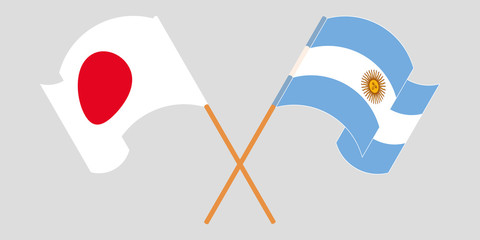 Crossed and waving flags of Argentina and Japan