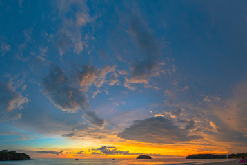 Fototapeta na wymiar .beautiful cloud in golden sky at sunset in Kata beach Phuket Thailand.