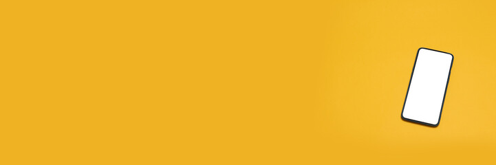 Top view of mobile phone screen blank template on yellow background with copy space,