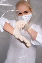Quarantined woman wears a protective mask.
Quarantined woman breakthrough of oilcloth.