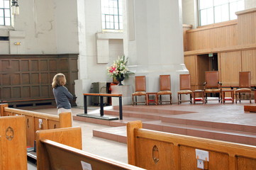 Mature female in church.