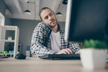 Photo of handsome business manager guy look computer monitor table speaking telephone client...