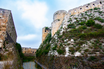 Fototapeta na wymiar Krak (Crac) des Chevaliers, also called (‎Castle of the Kurds), and formerly Crac de l'Ospital, is a Crusader castle in Syria and one of the most important preserved medieval castles in the world.