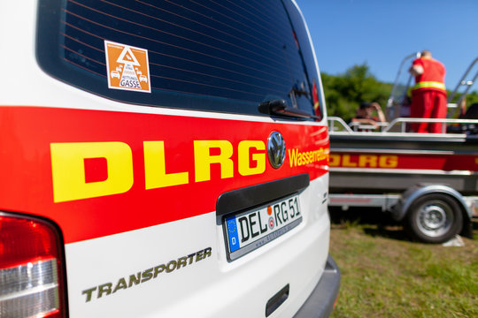 Delmenhorst / Germany - MAY 6, 2018: German Transporter from DLRG Wasserrettung stands on a meadow. DLRG Wasserrettung means German Lifeguard Association