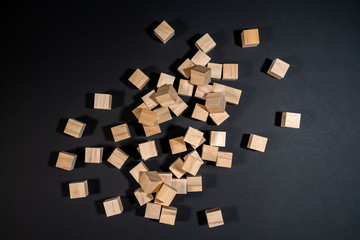 Wooden cubes on the black background