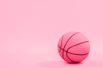Basketball ball isolated on pink background.