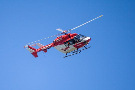 DELMENHORST / GERMANY - MAY 06, 2018: Eurocopter BK-117 from DRF Luftrettung flies over landing side. Notarzt means emergency doctor.