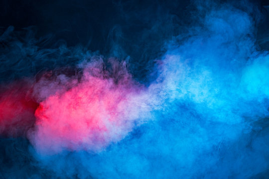 Background from texture of mixing red and blue smoke, abstraction.
