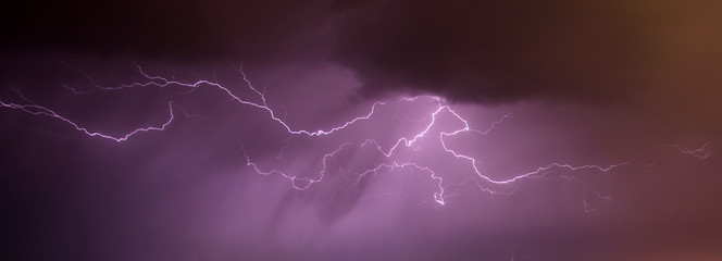 Night sky with various lightning in natural colors.	