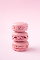 Fototapeta na wymiar Pink macarons on pink background