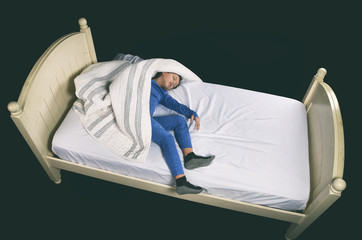 Little boy on bed in strange sleeping position © 3Days2Go Media