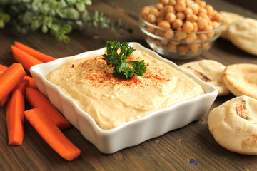 Bowl of chickpeas hummus with pita bread