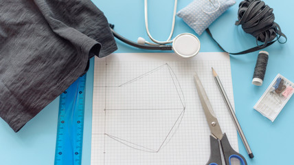 how to make a protective face mask at home from fabric, creating a markup pattern for sewing a mask, step-by-step instructions, step 1