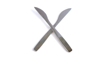 Dessert knives on a white background