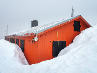 high level of snow around building of polar station in Antarctica